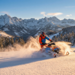snowmobiler riding through pristine snow